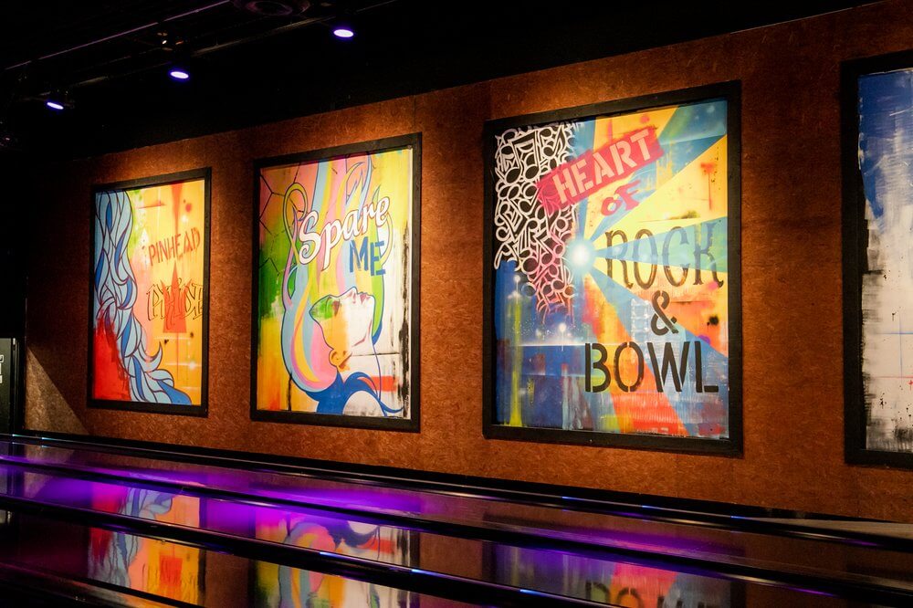 Vibrant and artistic murals bring energy to the bowling alley, adding a unique touch to the experience of bowling in San Marcos.