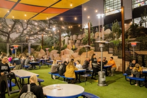 Guests celebrating in the beer garden at Draft Republic San Marcos.